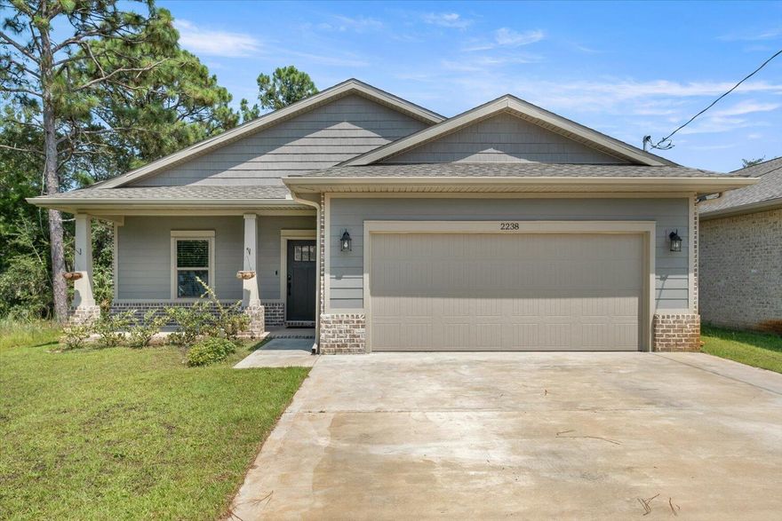 Are you looking for a beautiful home w/No HOA, then look no further.  2021 built Ramsey Walker 3 bedroom 2 bath home located in East Navarre, w/many upgrades throughout. Exterior is a timeless durability of brick, cement fiber board accents, & an architectural shingled roof. Sprinkler system & fenced backyard! Interior offers thick wood laminate flooring in the common areas, visually pleasing neutral tile in the baths & laundry room, carpet in the bedrooms.  Custom paint color is accented w/wide baseboards, beautiful crown molding, & spectacular tray ceiling accents in the owner bedroom, dining and entry area. Transom windows over the hall entryways provide a high end custom touch. Stainless steel appliances including refrigerator, stunning shaker style cabinets, and granite throughout