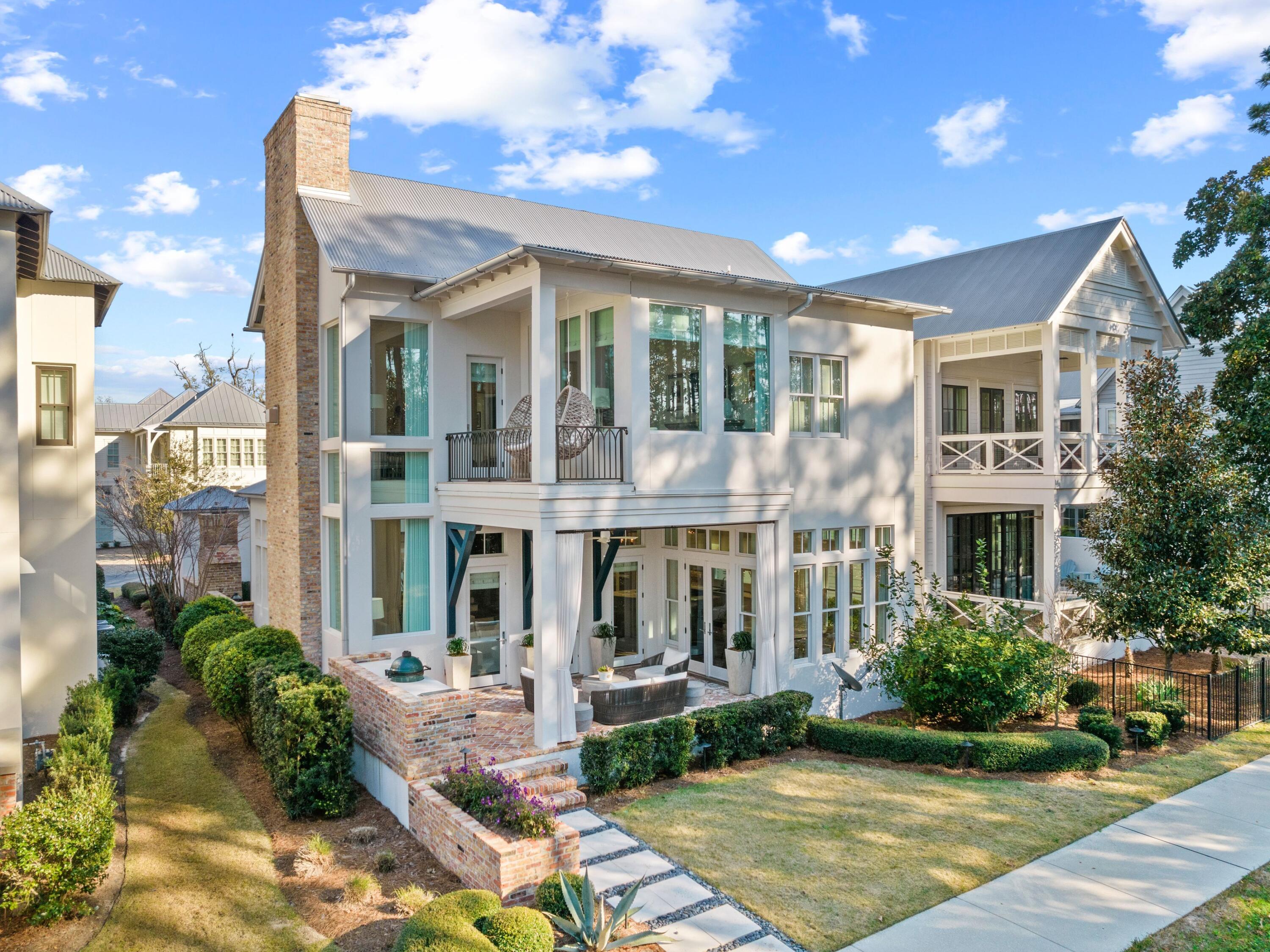 Thoughtfully curated interiors pay homage to nature in this 4,160-sq.-ft. home in the sought-after waterfront neighborhood of Churchill Oaks. Boasting four beds, four-and-a-half baths, a two-car garage and 12-ft. ceilings throughout, this contemporary residence also includes custom-stained sawn oak floors throughout and purposely placed windows that frame the surrounding pine trees outside. Beyond the custom wood entrance gate with security access, the home will delight your senses with reclaimed Chicago brick pavers, modern cabinetry, mantels, and shelving, including a custom, glass-walled wine cellar capable of holding 2,000 bottles.