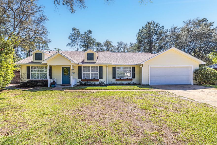 Beautiful home nestled on a .55 acre lot in desirable Bluewater Bay! Spacious living room with cathedral ceiling, cozy fireplace with brick surround, skylights, and rich wood-look tile flooring. Eat-in kitchen with charming breakfast nook, granite countertops, pantry, along with newer microwave (2021) and dishwasher (2020). Separate formal dining room.Off the back of the home is a delightful Florida Room that can be used year round. The primary bedroom has direct access to the Florida Room, and offers an en-suite bathroom with double vanity, walk-in closet, and shower/tub combo.Split-bedroom floor plan with RENOVATED guest bathroom featuring BRAND NEW tub, tile, vanity, light fixture, skylight, toilet, and fresh paint!The park-like backyard offers lush landscaping lined with flowering