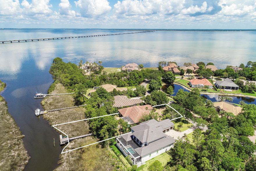 If you're ready to boat or head to the golf course, look no further! Regatta Bay is one of the most elite neighborhoods in the area and finding a residence this nice with a private boat dock and covered pool is rarely possible with todays limited inventory! 444 Captain Circle features a large entryway, expansive living area, and large formal dining area. This home is great for those who love to entertain but also has an office space and additional room that's been used as a fourth bedroom! It also features a spacious kitchen with a double oven, granite countertops, tile backsplash, custom cabinets, and a big pantry area. The glass doors open to a large screened lanai with a pool and spa/fountain. From there, you're just steps away to your personal dock and deep-water access to...