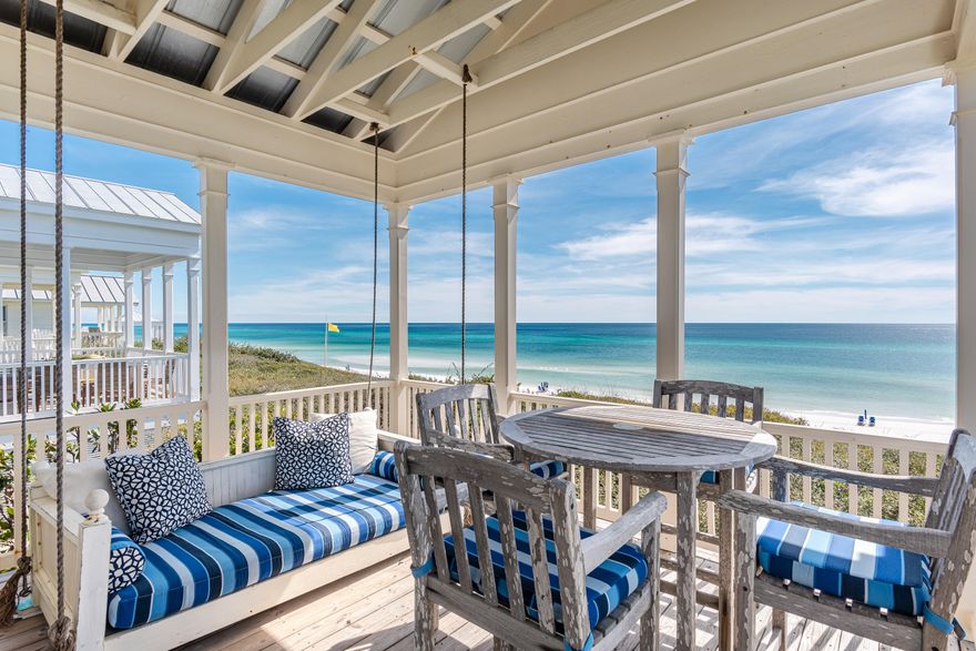 Pure and simple, but with an updated twist, this original Honeymoon Cottage stays true to the architect's intention. Modeled on Thomas Jefferson's home at Monticello, Scott Merrill's design was honored with a National American Institute of Architects Award of Excellence. Strategically snuggled into the dune and protected by a natural border of native scrub oaks, sits this two-story cottage with astounding views - east to west - of the aqua-blue Gulf of Mexico contrasted by the sugar-white sands for which our beaches are famous. Located in the award-winning community of SEASIDE, FLORIDA - selected by Time magazine as one of its ''Designs of the Decade'' - adds extra prominence.With a reverse floor plan, the master suite is comfortably positioned on the first floor to ensure