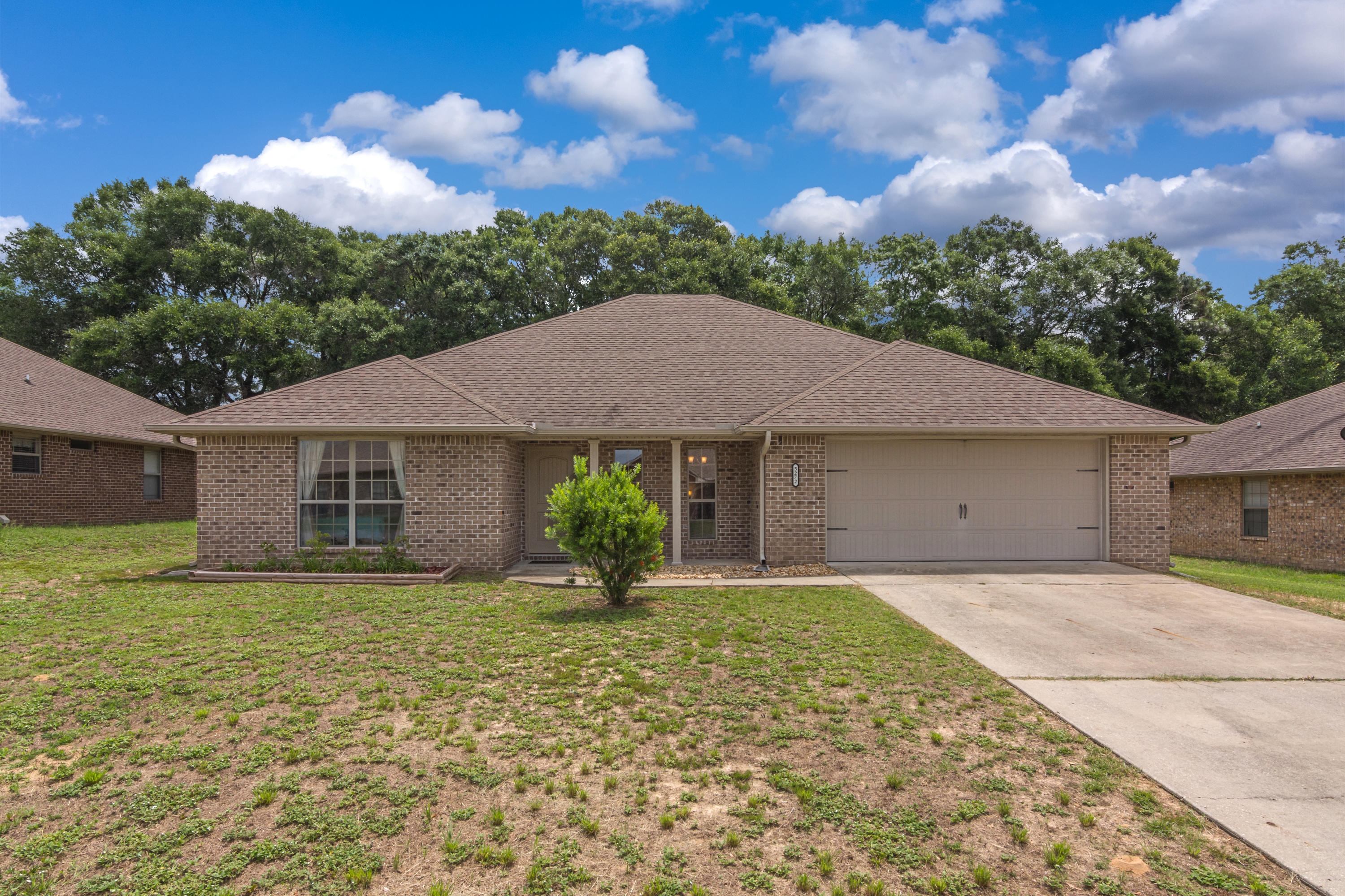 This beautiful home is located in Lee Farms subdivision. Inside you'll find porcelain tile and laminate flooring throughout. The kitchen comes with a stainless steel microwave, dishwasher, and smooth-top stove. The deep basin kitchen sink is under-mounted below the granite counter tops. Master bath boasts of a zero entry shower/tub room. Granite counters are also found in both bathrooms.