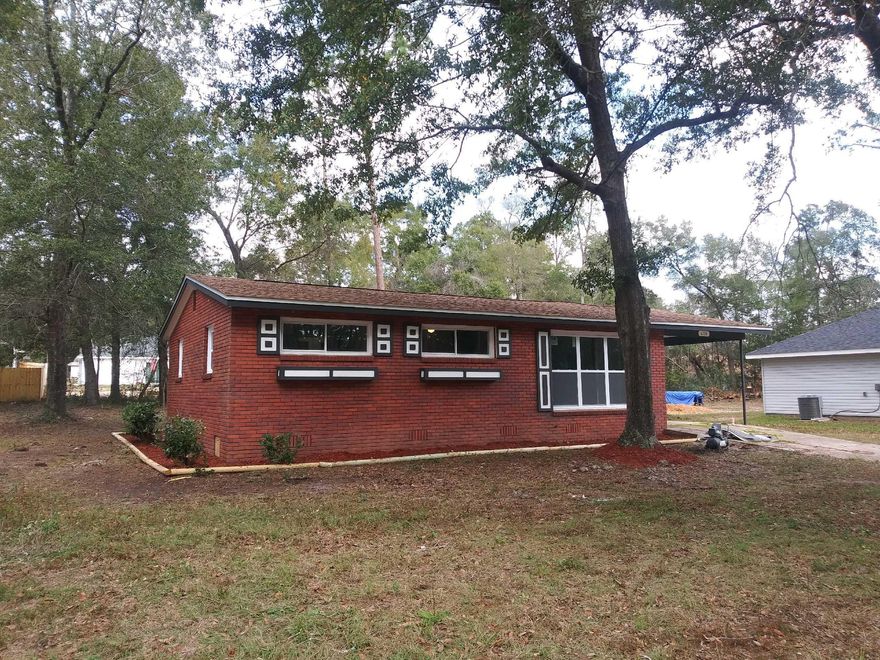 Look what the New Year is ringing in for you, a beautiful 3/1 remodeled all brick home on nearly half an acre. Payments for this could be less than rent and unlike a lot of rental properties pets will never be an issue again. There is an inside laundry with a carport and as a bonus you are only a few miles away from I-10, Hwy 90 a boat ramp and lots of other amenities. What a perfect way to start the New Year in a home of your own. Schedule a showing today, you won't be disappointed.