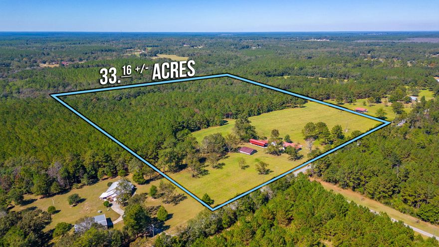 Charming Farmhouse on 33 Acres of Paradise! This is the quintessential country living experience you've been waiting for. Step into a cozy farmstead with portions of original hardwood flooring, exuding rustic charm. Enjoy the serene outdoors from the front porch swing, perfect for relaxation and sipping your morning coffee. Unleash your inner farmer or craftsman in the old barn, awaiting restoration to its former glory. The 10 acres of pasture land is ideal for horses, livestock, or your agricultural aspirations .Surrounded by pines and hardwoods, this property is a wildlife haven, making it a hunter's paradise. Wildlife enthusiasts will revel in the frequent visits of deer, offering countless opportunities for observation. A brand new HVAC unit was installed in October 2023 for your year-round comfort. A 17x60 pole barn/RV shed on a concrete slab, an 18x25 metal carport, and a 24x24 garage/workshop offer generous storage and workspace options. Over 1,000 feet of paved road frontage affording easy access and a sense of privacy make this property truly exceptional. This is country living at its finest, where you can create your own slice of paradise. Don't miss out on this unique opportunity to call this property home. Schedule your visit today and start living the life you've always dreamed of.