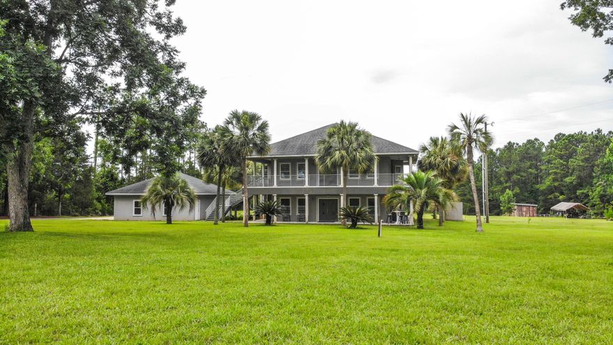 Looking for home in the country away from the hustle and bustle?  Plenty of peace and quiet on this 33.34 acres in country setting.  Stream and pond on property.  Home is unique and tastefully built.  Many extras such as recessed lighting, arched doorways, spiral staircase, trayed ceilings, & entertainment room wired for stereo sound.  Lots of beautiful cabinets throughout the home.  Office, master bedroom & master bath, half bath, living room, kitchen & dining room downstairs.  Kitchen is a dream with huge stainless steel fridge/freezer combo, microwave/convection oven, and farmhouse ss sink. Two bedrooms, full bath, and entertainment room upstairs.  Upstairs could be separate living quarters having its own separate entrance.  Some furnishings may stay. Double garage.