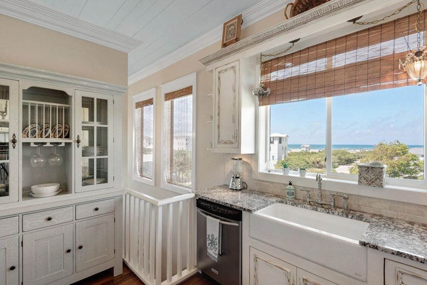 Enjoy the spectacular gulf views from the balconies of this beautiful 3-story Inlet Beach home! Fabulously located near Rosemary Beach and two beach accesses, this home is also a short distance away from all the food, shopping, and fun offered by 30A Avenue as well as Pier Park. Relax in the luxurious first floor master suite with double vanities, garden tub, and expansive shower. Ride the PRIVATE ELEVATOR up to the second floor to find an oversized bedroom, en suite bath, and balcony. The third floor living area features a Chef's Kitchen complete with granite countertops, custom cabinets, and Viking range. Guests will also love the large island and open living space as well as the incredible views of the spacious balcony. Other features include cypress floors, 12' ceilings, and oversized glass sliding doors. Hang out on the patio in the fenced-in backyard after a day at the beach. Did we mention balconies on both the 2nd and 3rd floors? This home will make a great primary home or vacation rental. Come see for yourself