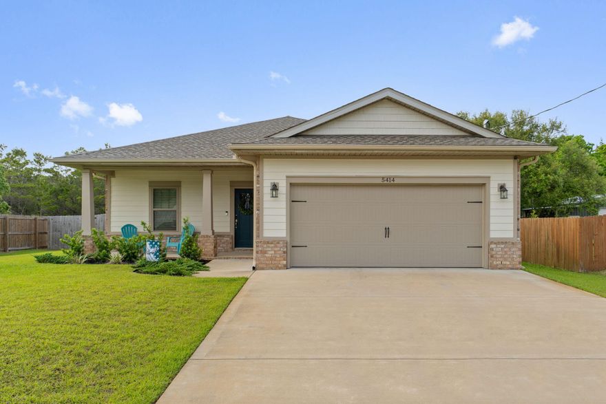 Welcome home to this exceptional and practically new move in ready 3 bedroom/2 bath home with many upgrades throughout on a great sized 0.27 acre lot with no HOA and walking distance to the Woodlawn Beach boat ramp! Adorned with the timeless durability of brick, cement fiber board accents, and an architectural shingled roof have peace of mind with a home and all major systems just installed in 2022. Pull into the driveway and appreciate the well maintained landscaping and craftsman style exterior with an adorable front porch. Enter inside and you'll immediately love upgrades like crown molding, trey ceilings, transom windows over the hall entryways for a custom touch, and bathrooms, and luxury vinyl plank flooring throughout all the common areas. This open floor plan with recessed lighting features a great sized living room open to the well appointed kitchen where you'll find timeless white soft close cabinets and drawers, granite counters, stainless appliances, and drop down pendant lighting and is open to the dining room with another trey ceiling with crown molding. The master bedroom is a retreat in this split floor plan and has plenty of room for your king bedroom suite underneath another trey ceiling with an en suite that has double granite vanities, a walk in closet, framed mirrors and upgraded lighting, a soaking tub with tile surround, and a private water closet. The two additional bedrooms are found on the other size of the house with ample closet space of their own and another full bathroom with all the same updated finishes you're looking for. There is a great sized interior laundry room and the two car garage has an upgraded epoxy coating on the floor. Outside is a covered back patio overlooking the fully fenced in backyard complete with an irrigation system and gutters, and there is even a built in pest control system in the wall for easy treatment! Don't delay on this Gulf Breeze gem perfectly located near beautiful Emerald Coast beaches and experience the best of Florida living.
