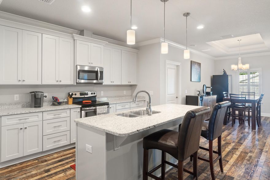 Welcome to this craftsman home that was designed in 2018! The most spacious layout with all the crisp white and gray touches throughout the home. Crown molding, tall ceilings, oversized island, and stainless steel appliances convey! This is the one and only, Ramsey & Walker Custom home that is hard to find! They designed this home with an oversized back covered patio for plenty of shade. The home is fully fenced, an easy to care for landscape, and is located on a cul de sac road. The home is minutes from the beach, no flood zone, and very close to the schools! Having an East Navarre home will give you a quicker commute to Hurlburt Field AFB as well. The floor is a gorgeous tile that looks like variations of wood. High end features like plantations shutters on all the windows also. MUST SEE