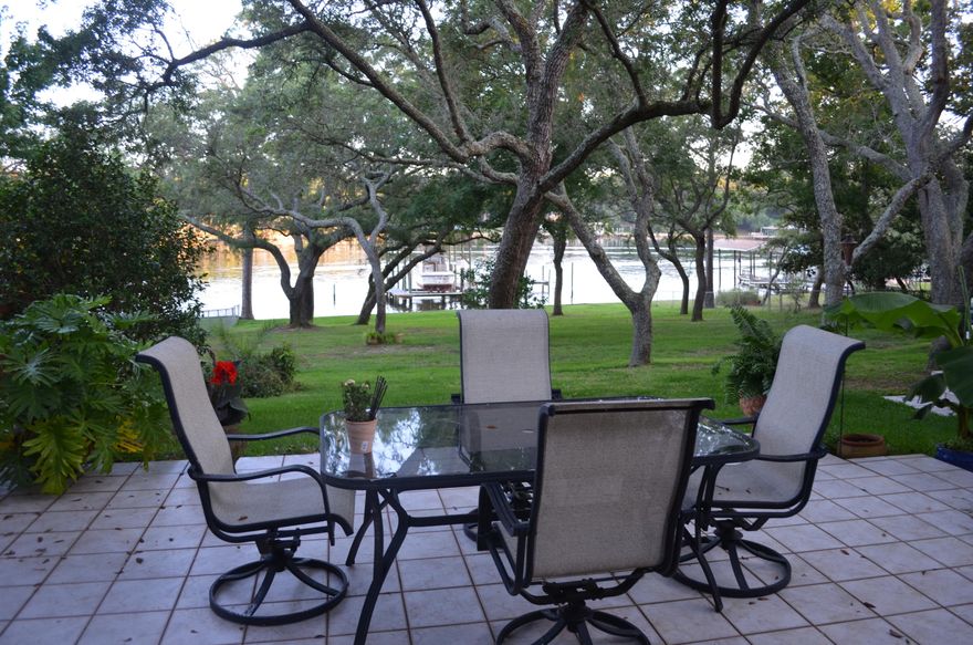 Amazing opportunity to own one of the most spectacular waterfront homes you will find anywhere and priced to sell quickly. South facing which provides better breezes and fewer mosquitos, high and dry with fantastic water views from the three most important rooms in the house - The beautifully remodeled Kitchen, the large Master Bedroom and the Family Room. Home is surrounded by mature oaks and magnolias providing plenty of shade for enjoyable back yard entertaining or just relaxing on those lazy summer afternoons waiting for the sun to set. 95 feet of waterfront with a large dock, covered boat slip, and a 10,000 pound boat lift complete the waterfront package.This home is at least 16 feet above sea level - flood insurance is not required or needed even if they do redraw the flood ma