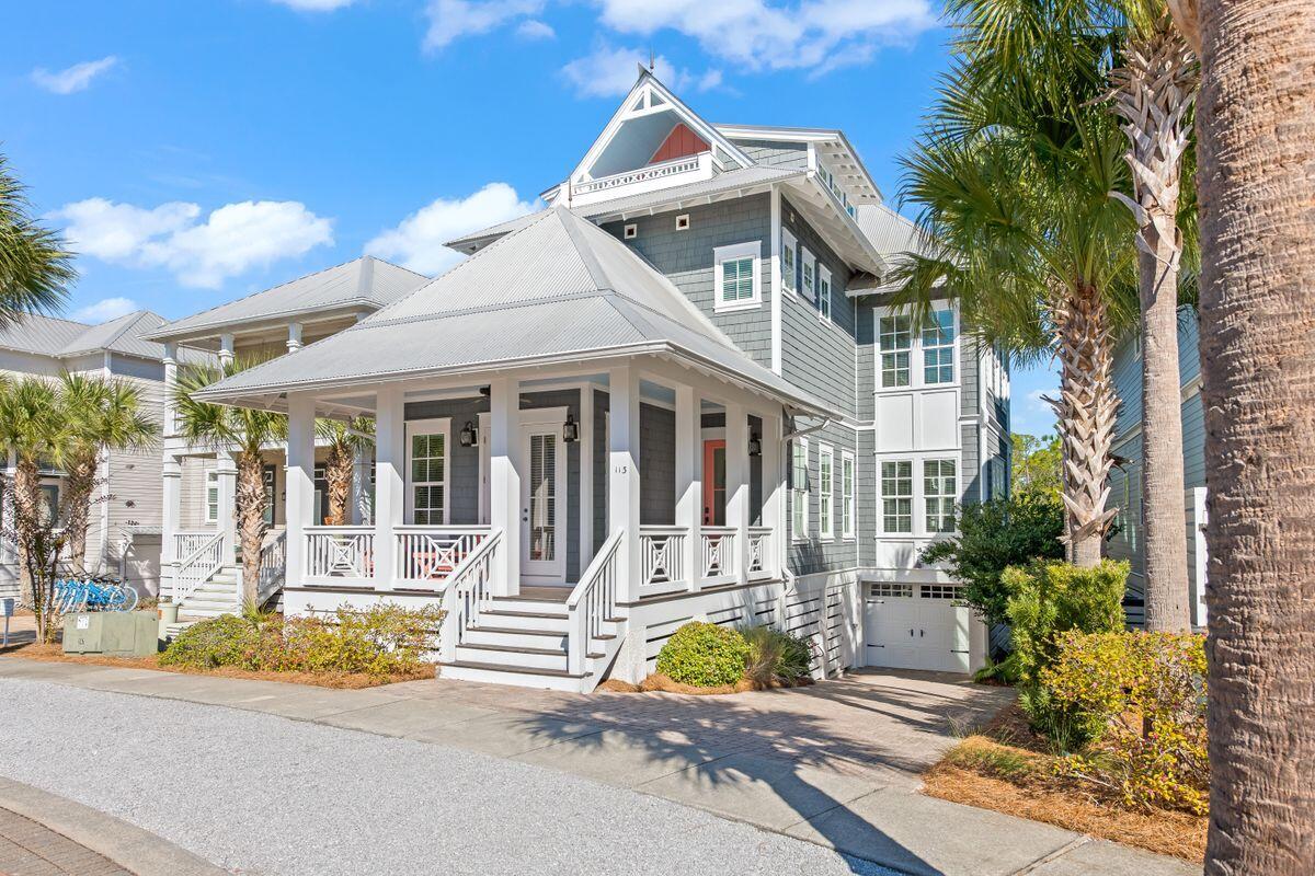 This Classic Coastal style custom home enjoys exceptional privacy overlooking forever green space to the rear. Designed by Greg Jazayeri and built by James Emerick of Watercress Homes, it showcases outstanding architectural design with porches and decks on three floors. The covered front porch will be a favored sitting place for watching the world go by along the palm-lined streets of Seacrest Beach. Inside the home, the great room will make you pause and admire the lofty coffered 10-ft. ceiling, elegant crown molding, hardwood flooring and abundance of natural light. French doors open directly onto the shady porch providing an open-air space for dining and relaxing. It's an incredible space designed for entertaining and sharing happy times with family and friends.