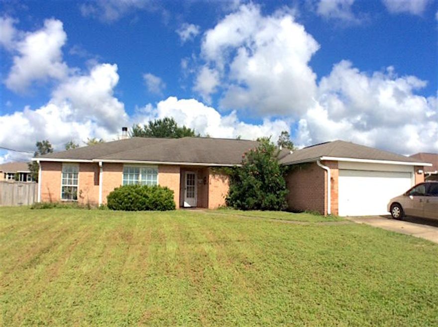 THIS HOME IS BEING OFFERED AS A SHORT SALE. This all brick home offers High ceilings, formal dining area, breakfast nook, office, wood burning fireplace, granite countered kitchen, and more. Split bedroom floor plan makes it perfect for family or visitors. Kitchen features granite countertops, center island, tiled backsplash, and plenty of storage. Separate laundry room, 2 car garage, irrigation system, fenced backyard with yard building and screened patio. Conveniently located to schools, , south of I-10, close to bases, shopping, and restaurants. And less than 40 minutes to the best beaches in the world! Some work needed.