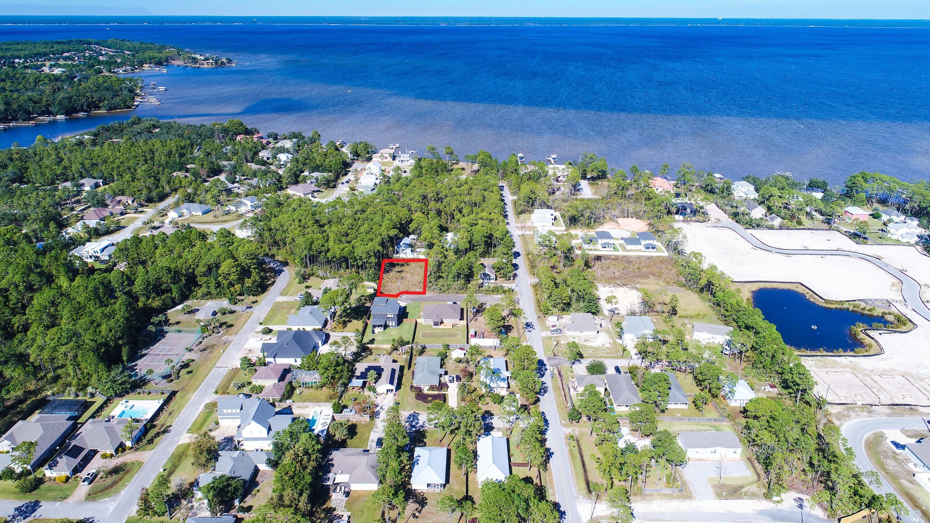 Great opportunity to build your dream beach home on a quarter acre lot! This lot is conveniently located next to Grand Boulevard, Sacred Heart Hospital, the Choctawhatchee Bay as well as the pristine beaches of South Walton, and is only a 5 minute drive to iconic 30A offering great local entertainment, dining, and shopping. In just a quick 10 minute drive, you'll have your toes in the sugar-white sand along the emerald green & crystal blue waters of the Gulf of Mexico. Start living that coastal lifestyle you desire with boating, fishing, kayaking, and paddle boarding all at your fingertips!