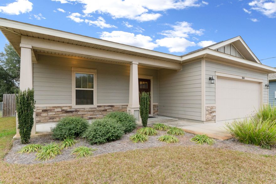 Open House scheduled for Thursday, February 27th from 1pm-3pm. Welcome to this gorgeous Navarre home conveniently located close to schools, restaurants, military bases, and the Navarre Beach bridge. This like-new home (built in 2016) features beautiful wood-look laminate flooring throughout most of the home and tile in the bathrooms. With 9' ceilings, this home feels extra spacious and modern. There are tray ceilings in the entry, dining room, and master bedroom. There is elegant crown molding and wide base boards throughout. This open floor plan boasts beautiful rich colored cabinets, stainless steel appliances, and granite countertops. The bedrooms are carpeted with a nice neutral color. The master bathroom features a double vanity with granite countertops.