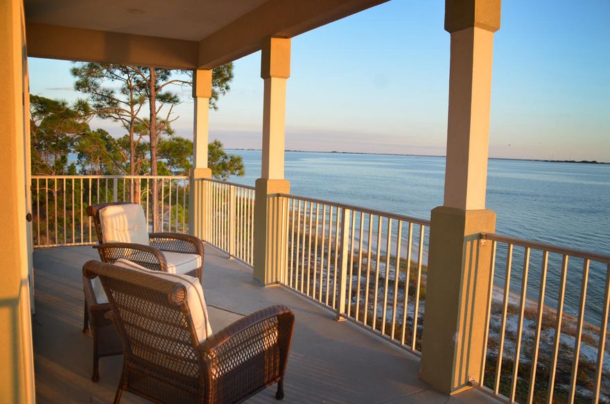 Beautiful custom built bay front home with 4 bedrooms and 2.5 baths on the Santa Rosa Sound. This home was built on 14' wood pilings with wind rated windows and metal roof. Home has an updated kitchen with stainless appliances and granite counter tops. Kitchen, dining and living room and master bedroom all have spectacular views of the sound. Outdoors enjoy over 800 SF of balconies. Lot 90' wide on sound with wood pier, boat slip and lift. Projected gross rental income approximately $65K-$75K annually. Seller owns commercial building for sale that adjoins property. See MLS #820849. Buyer to confirm all dimensions and square footage.