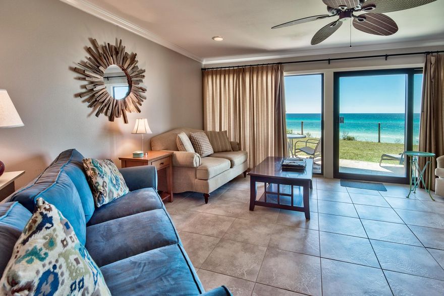 This incredible ground floor Gulf front condo in the heart of Blue Mountain Beach showcases great views of the Gulf from its large patio with access from the open living area. The floor-to-ceiling sliding glass doors in the living room area frame the picturesque Gulf view. High 9 foot ceilings with crown molding and tile floors that carry throughout the principal living areas accentuate the spaciousness of the open floor plan. The stylish kitchen features modern raised panel cabinets and stainless steel appliances. The master bathroom features a granite counter top and large walk-in shower with sleek frameless glass door. With convenient location near dining, shopping, and entertainment & easy access to Gulf Place, Watercolor, and Seaside this is an opportunity you won't want to miss.