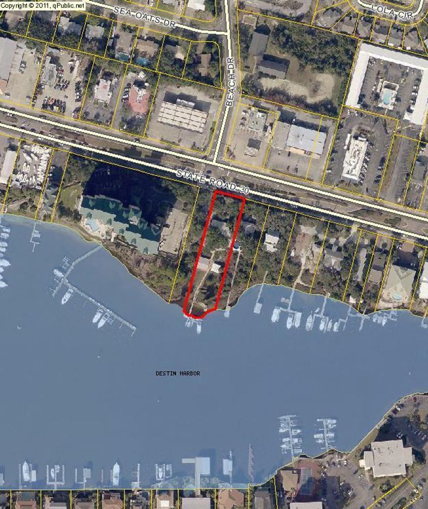 This prime harbor front, 90 x 350 deep lot, has two homes, both currently leased by tenants.. All structures on the property were built prior to 1970. This includes a two-bedroom, two-bath house built in 1964 with 1,412 sq.ft heated/base area with a finished enclosed porch, finished open porch, and fireplace. Down the bluff toward the water is a smaller two-bedroom one-bath house also currently leased by a tenant. An additional structure built in the 1950s is located adjacent to the smaller home and is vacant. The property has docks with four boat slips. Lot dimensions should be confirmed by Survey, square footage and room dimensions of all structures to be verfied by buyer.