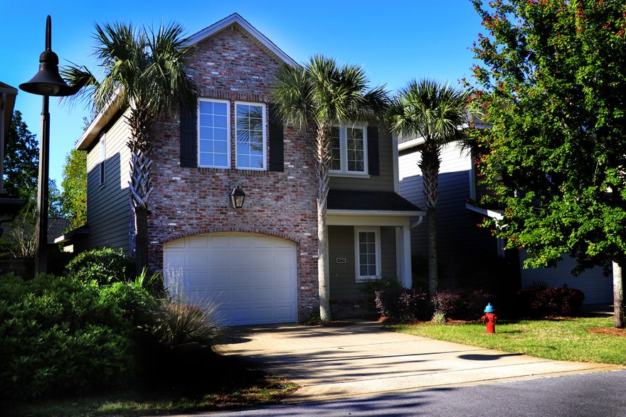 Impressive and spacious 3 bed, 2 bath home in Bluewater Bay, Marina Landing subdivision. Nicely designed, open floor plan. Exterior features hardboard with beautiful brick accents set in the Florida craftsman style. Crown molding and hardwood flooring down stairs, 9 ft ceilings and 8 ft classic, raised panel doors throughout. Foyer opens to living and dining room areas. Kitchen features granite counter tops, stainless GE appliances, breakfast bar, spacious pantry and separate dining room opens to backyard and patio. Vinyl insulated windows, custom panel cabinets, pre-wired security system. Master bedroom is located on the first floor with adjacent large master bath w/double vanity, and walk-in closet. Two additional bedrooms are upstairs with a spacious loft perfect for an office, media room or kid's play area. Nicely landscaped with fenced back yard w/private patio area and sprinkler system maintained by affordable HOA $125/month. .Gas tankless hot water heater.