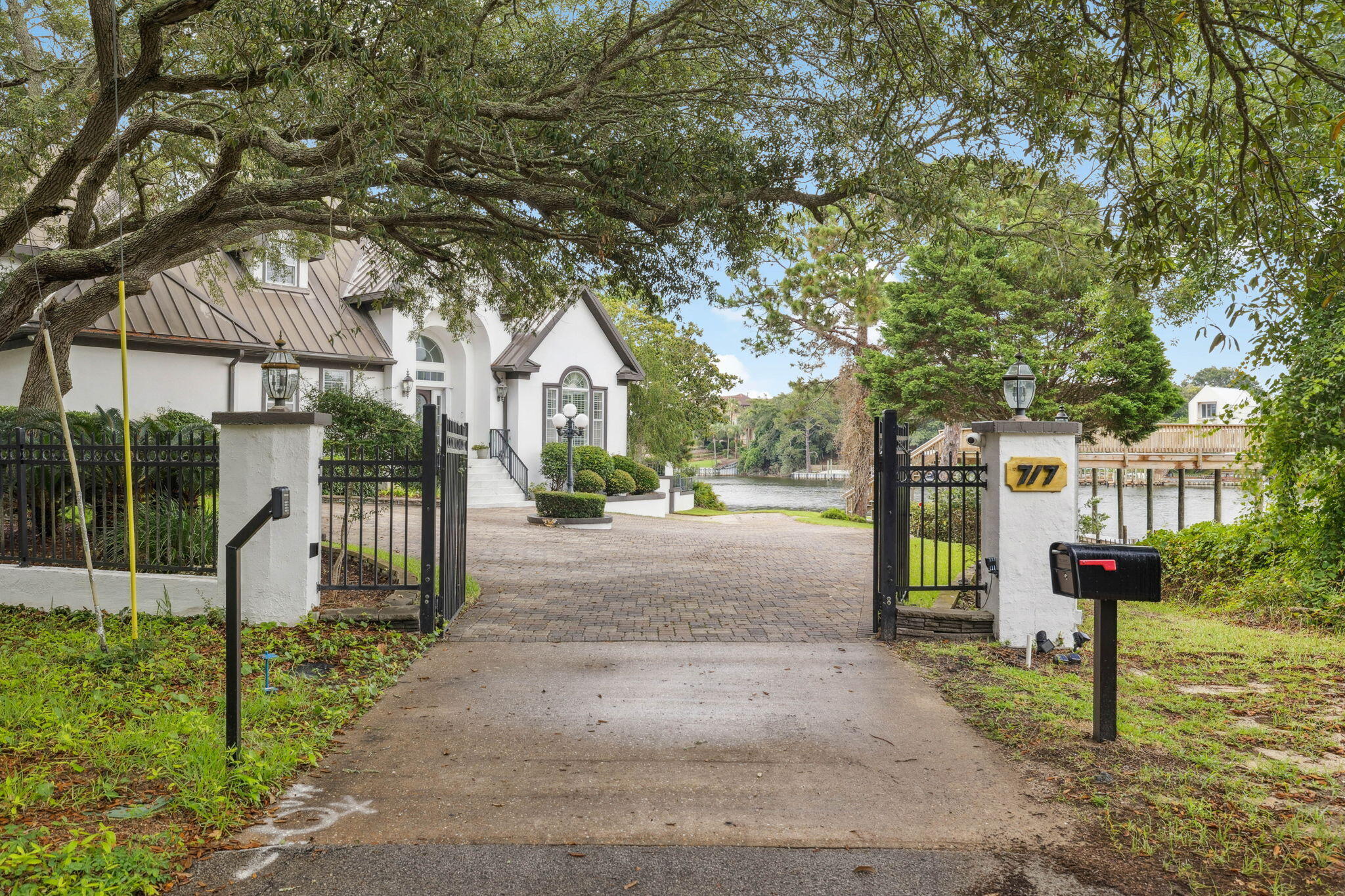 MOTIVATED SELLER!!!**Exquisite Waterfront Oasis on Joe's Bayou - No HOA**Experience the epitome of waterfront living with this breathtaking estate that graces a vast .87-acre peninsula point lot, boasting an impressive 657 feet of prime water frontage on Joe's Bayou. Fresh from a meticulous renovation, this property presents an unparalleled opportunity to own a slice of paradise with deep water access and a newly constructed deck, ready to accommodate your boating adventures.