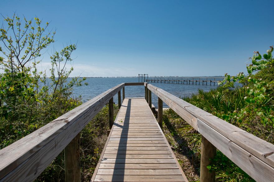 ***BACK ON MARKET DUE TO BUYER DEFAULT***
SIMPLY ELEGANT! Finally, a Craftsman Style pool home near the water! This home was custom designed with every detail of elegance in mind. This lovely community features a sound side breeze & views of boats and paddle boarding sailing by. Take a dip in your own Gunite pool and splash pad. Did you need a home with plenty of closets and storage space? This home has that exactly! There is also a BONUS 4TH ROOM that would make a great office space, den or work out room. Gas range top, upgraded tile, sleek counters and chandeliers are throughout the home. Insurance is at an all time low with this newer home. Only 1900* INCLUDING flood insurance per year. VERY ATTRACTIVE POOL HOME! EXQUISITE LIVING IN VILLA VIZCAYA