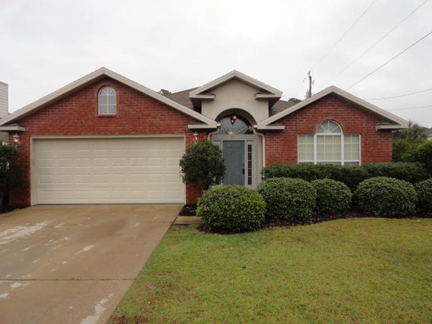 FRESH NEW PAINT THROUGOUT!! Your family will love this 3 bedroom 2 bath home in Olde Florida Lakes. Conveniently located only minutes to shopping, restaurants and the beach! The large corner lot is beautifully landscaped and you will enjoy the screened porch while the kids play in the fenced yard. The high ceilings in the foyer and living room make this home feel much larger. The Kitchen is well equipped offering solid surface counter tops, a breakfast bar and it is open to the dining area. The master bedroom has treyed ceilings and crown molding adding elegance to the room. The master bath has vaulted ceilings with a separate shower and garden tub. The location of the home gives you rare access to the beach via golf cart which can be stored in your 2 car garage.