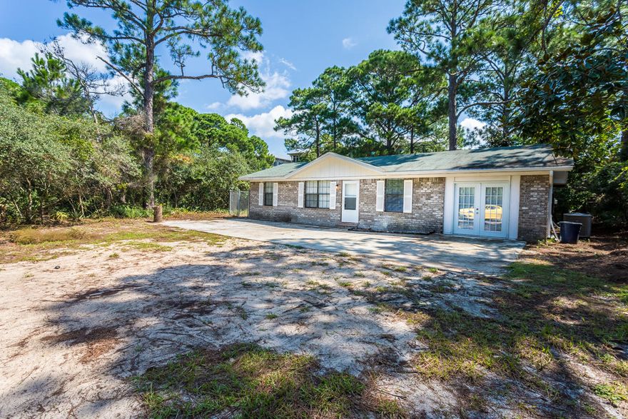 Located ion the heart of Seagrove Beach and only ONE block from the Gulf this lot is nearly 4/10ths of an acre. This contemporary older home could either be remodeled or removed to make room for 2 homes. Beautifully treed property and near the beaches, commercial areas of 30-A and centrally located. This ia a rare property at an incredibly LOW price for Seagrove. Bring all offers...