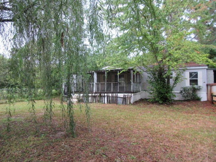 What a great wooded .75 acre REO lot close to Hogtown Bayou! Fantastic spot to build your dream home. The location is close to the bay, shopping, schools, restaurants, employment opportunities and the beautiful South Walton Beaches. The value is in the land not the buildings.