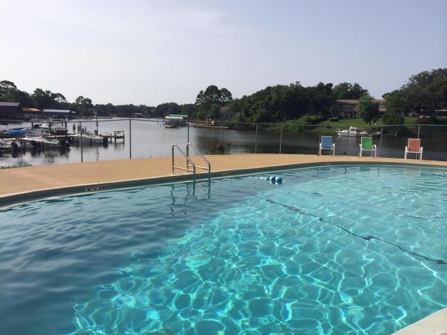 THIS UNIT HAS A NICE REHAB AND UPDATED. TILE FLOORS THROUGH OUT WITH WOOD GRAIN TILE IN LIVING ROOM. KITCHEN HAS UPGRADED CABINETS WITH SIDE BY SIDE REFRIGERATOR/FREEZER. STACK PACK WASHER AND DRYER CONVEYS WITH THE UNIT. THIS IS CONVENIENT TO BOTH HURLBERT AND EGLIN. PERFECT TO LIVE OFF BASE WITH A ROOMMATE TO SHARE EXPENCES. OWNER COULD LIVE THERE FREE AS BAH AND RENTER SHOULD COVER EXPENCES. THE COMPLEX OFFERS BOAT SLIPS ON A FIRST COME FIRST SERVE BASIS********* SPECIAL OFFER******