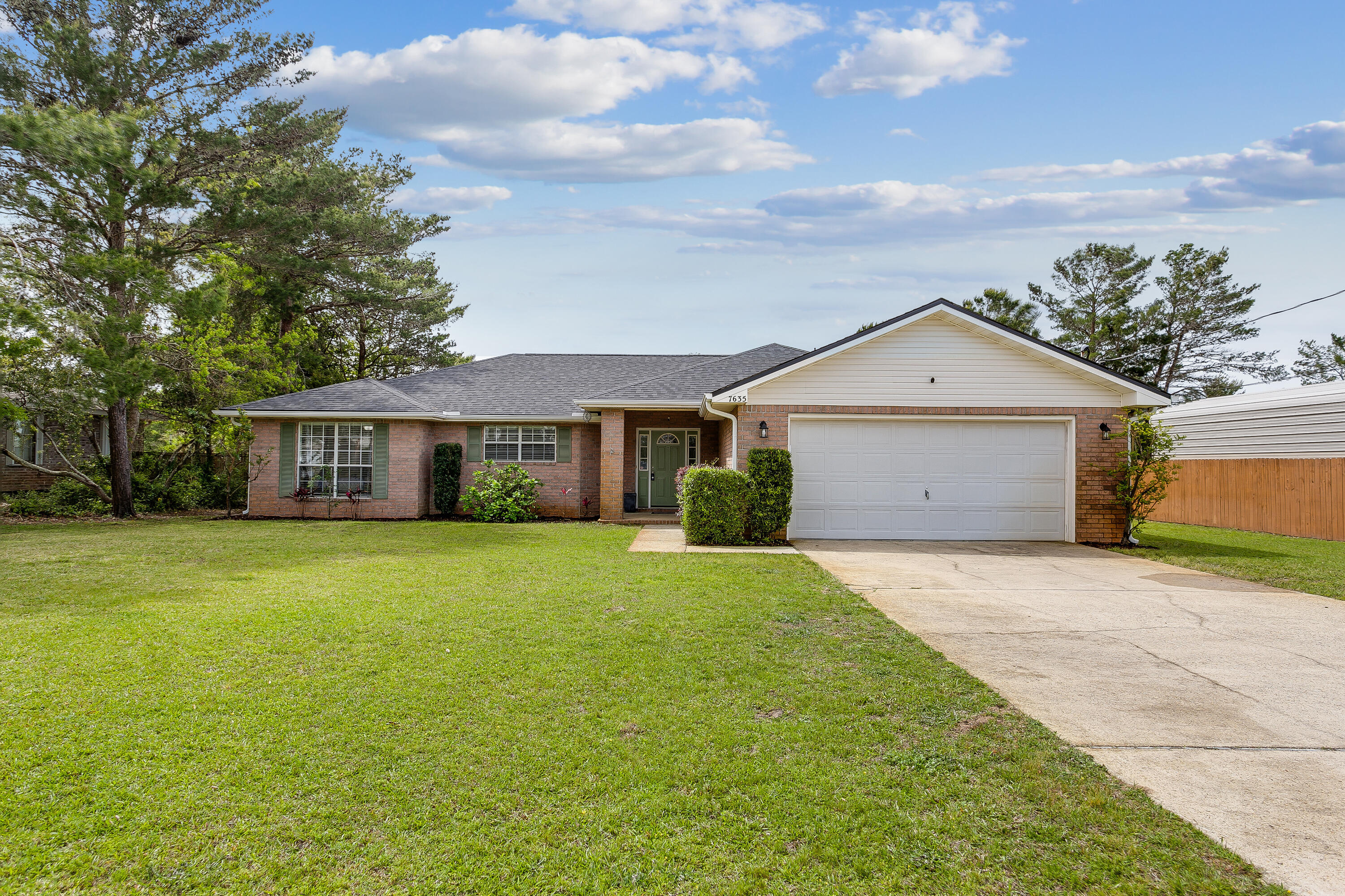 Brick home in Holley By The Sea! Move in ready! This home has it all; privacy fenced back yard, 2 car garage, and open concept floor plan. The living room and kitchen have vinyl plank flooring throughout. The bright and airy living room has plenty of space for your family and entertaining, other features include: high ceilings and sliding glass doors that walk out into the large privacy fenced backyard. The master bedroom has high trey ceilings and a walk-in closet, master bath has dual sinks, granite countertops and tub/shower combo and tile flooring. Bedrooms have carpet and are a great size. Check out this beautiful home today!