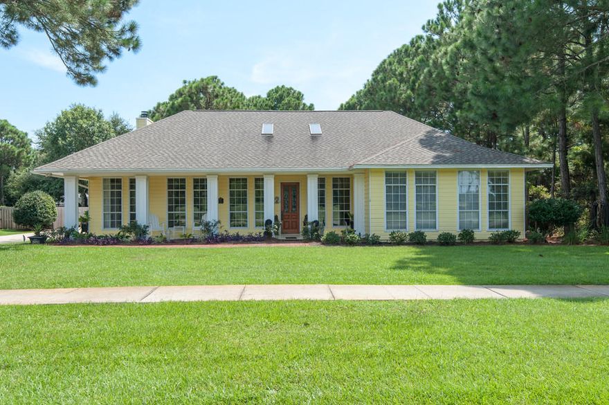 A sunny disposition and serious bones combine to make this freshly painted Indian Bayou home catch the eye. Located within steps of Indian Bayou Country Club, golfing and dining are just beyond the covered front porch. Light-filled interiors are open and airy with twelve 8' windows lining the front faade. Architectural elements include a wood-burning fireplace, 10' ceilings, and hardwood flooring. Immaculate and updated, the kitchen includes new granite counters and new appliances. Hardwoods were recently replaced throughout the home. Creature comforts include surround sound, a steam shower, and double sinks. Oversized parking allows for plenty of guests and the screened porch and outdoor LED accent lighting beg them to stay awhile. The spotless garage includes a workshop space. Located right across the street from Indian Bayou Golf Club, this 27 hole course is rated a 4.4 out of 5 from Golf Advisor.