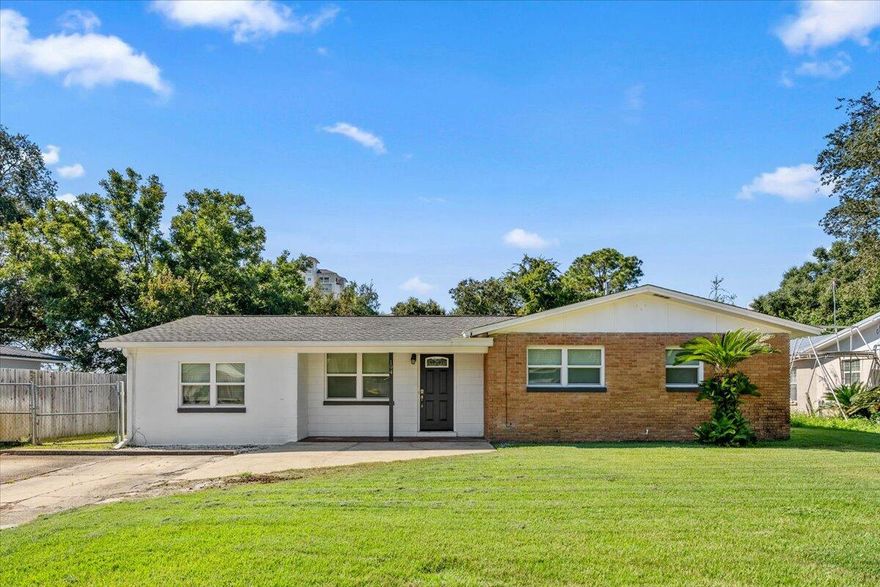 This updated 3 bedroom, 1.5 bath house has all the space and features you've been looking for! With two living areas, there's plenty of room to spread out--whether you need a cozy movie spot, a playroom, or a home office.The screened-in back porch is perfect for relaxing year-round, while the fully fenced backyard gives you space for gardening, pets, or entertaining friends. Out back you'll also find a powered workshop, ready for your hobbies, DIY projects, or extra storage.Practical touches like an in-house washer and dryer make daily life easy, and the location puts you around everything you need--just 2.4 miles from the beach! Don't miss your chance to own this versatile home with updates, space, and charm. Call your favorite Realtor today to schedule a showing!