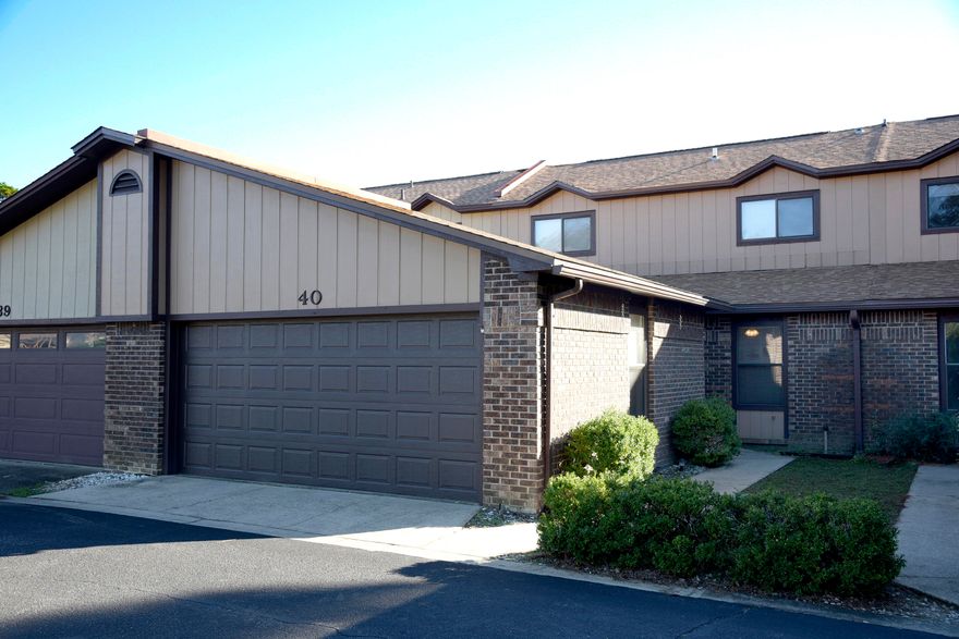 You'll love this spacious townhome in the serene community of Hidden Cove.The open floor plan features an efficiently designed kitchen with pass through to the dining area/great room featuring vaulted ceilings, a stone accent wood burning fireplace and luxury vinyl plank flooring. Two sets of sliding glass doors open to the long covered porch overlooking the pool area. A half bath, laundry room and master bedroom are also conveniently located on the first floor.  The master bedroom has luxury vinyl plank flooring and an en suite bath. Upstairs you'll find a loft overlooking the great room as well as two additional bedrooms and a full bath.   An extra bonus is the full two car garage with pull down stairs to access the attic. Enjoy all the amenities of Hidden Cove - a pool, tennis courts, community dock, boat slips available for rent on a first come first served basis and gorgeous views of the bayou.  HVAC 2014 and HWH 2015. Call today for your appointment to view this special property!