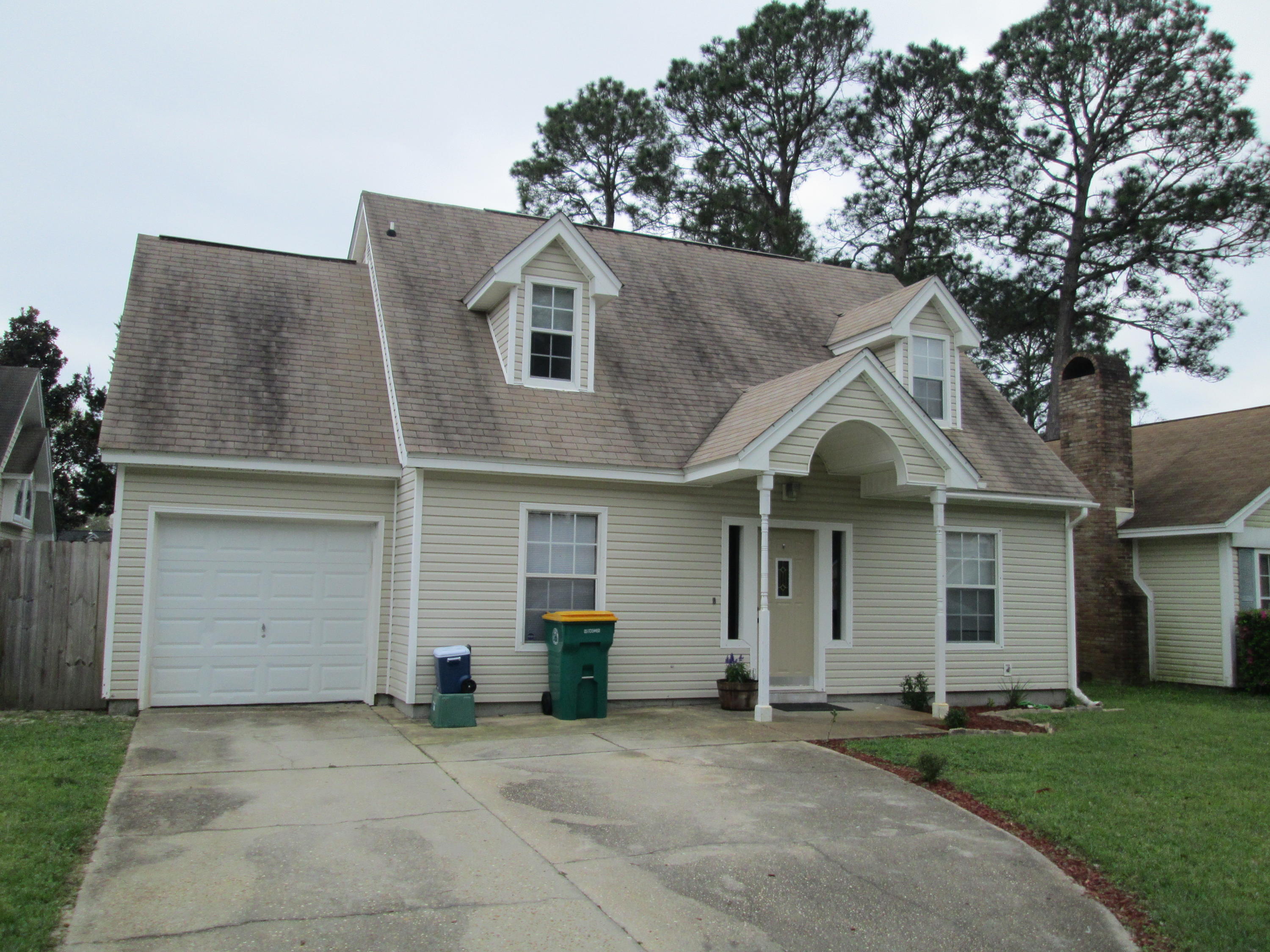 Charming home with renovated kitchen and complimentary granite counter tops. Tiled kitchen and wood laminate in main living areas. Enjoy the large screened in porch and the sizable back yard which is perfect for yard games or animals.