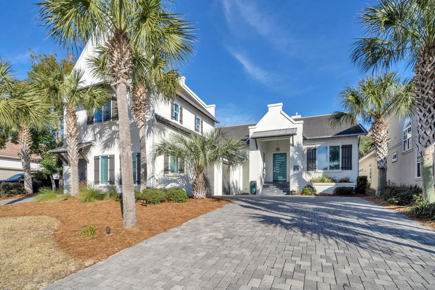 Nestled within the prestigious gated community of Destiny East, this fully furnished residence exemplifies coastal contemporary design. Situated mere moments from the pristine Emerald Coast shoreline, this lovely 5BR/4BA home caters to the discerning tastes of those seeking an exquisite rental, primary residence, or second home. The impressive foyer introduces an abundance of natural light, courtesy of a magnificent wall of floor-to-ceiling windows while leading to a spacious, open floor plan. The main living area exudes a sense of grandeur with in-lay reclaimed hardwood floors, lofty 12-foot ceilings, and a striking slate gas fireplace that extends to the ceiling. A complete wall of doors in the living opens to the lush gardens and tranquil outdoor pool area. Step outside to discover a captivating outdoor haven, complete with a covered kitchen and an expansive entertainment area, seamlessly merging the boundaries between indoor and outdoor living. Four elegant bedrooms in the main home and a guest suite over the garage provide the ultimate spaces for relaxation. Indulge a luxurious coastal lifestyle, where every detail has been meticulously curated to elevate the experience of home, conveniently located mere minutes from the shopping, dining, and activities of Destin and Miramar Beach.