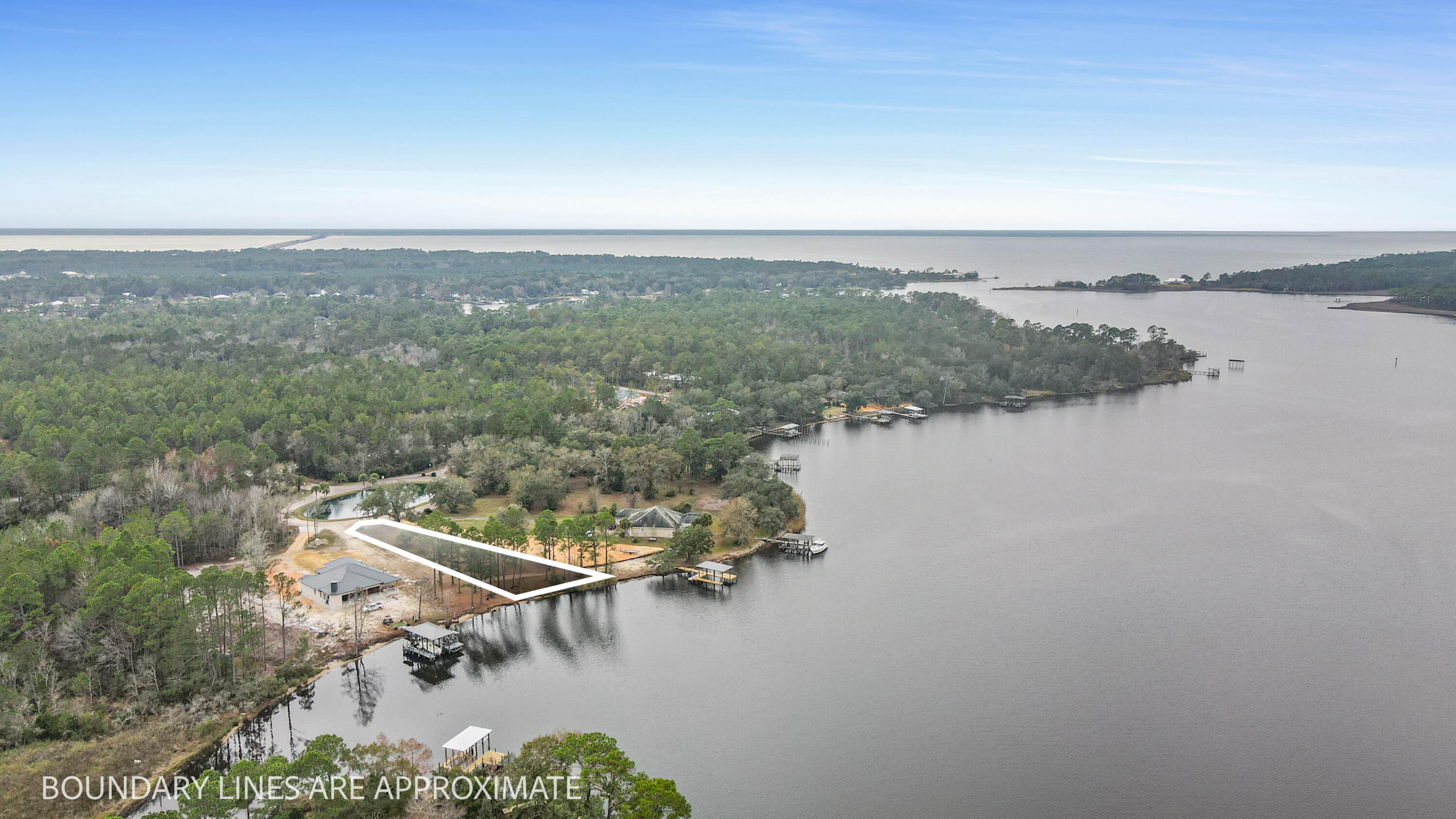 Build your dream home on this gorgeous 1/2 acre, 86 ft waterfront lot in the gated community off Lagrange Cove. As you enter the neighborhood you are greeted by mature oak trees and a huge preserve with an abundance of wildlife living in it. This community has only 12 waterfront lots. Lot 9 faces north with a beautiful view out to the bay. Close proximity to the Marina. Easy and quick boating to the great restaurants at the foot of the 331 bridge. Amazing fishing right off this lot. Build your dream home on this rare waterfront lot in the growing community of Freeport.