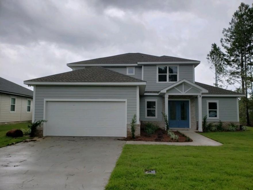 Custom built New home located in the beautiful Hammock Bay Community. Home has open floor plan with lots of upgrades: 10' and 11' Ceilings, 22' Living Room Ceiling, Interior Brick Accent Wall, Barn Door to Master Suite, V-groove Kitchen Island, Marble Back Splash, Granite Countertops, All Led Lighting, Master Ceiling Accent Lighting, and Full Kitchen Appliance Package. Home has 4 Bedrooms with 3.5 Baths. The Master Suite is located on the First Floor with Private Shower, Soaking Tub, 7' Double Vanity, and Custom Framed Mirror. The Home also has a second Master Suite located on the 2nd Floor with Private Bath and overlooks the lake. Lots of Extra Storage with Walk-In Pantry, Large Laundry Room, Under Stair Closet, Attic Storage in Garage, and Linen Closets.