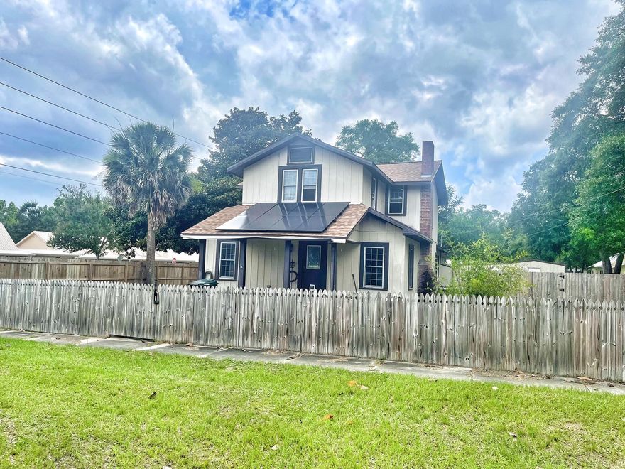**SELLER OFFERING $10k flooring allowance with full price offer** If  you have been looking for a home located near Lake DeFuniak and the Historic District, this one is for you!  This home was built in 1910 with a major renovation in 2017 to include 2 new HVAC systems.  New roof and solar panels were installed in 2021. This home has a large, fenced yard with electronic gate perfect for privacy for your children and pets. The interior of the home features a spacious family room with a gas fireplace, master bedroom and bath are located on the 1st floor and other 3 bedrooms are on the second floor with a full bath. Large kitchen with updated appliances and lots of cabinets.  This home could benefit from some cosmetic updates and your own personal touch.