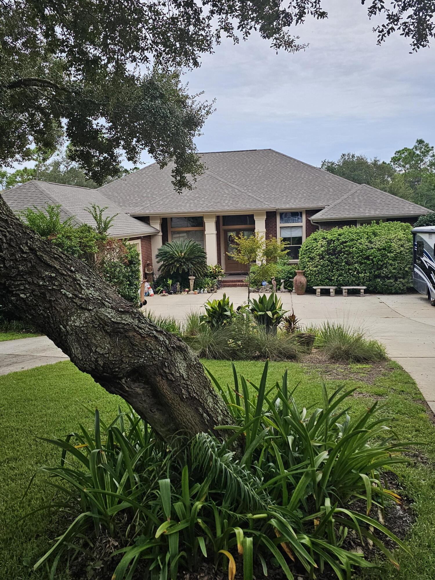 PRICE REDUCED !!!!NEWLY PAINTED interior boasts a warm, neutral color, giving this home a bright, clean and welcoming appearance. Located on nearly one acre in the beautifully established Tom King Estates, this 4BR/3Bath pool home does not disappoint.Nestled amongst matured trees and landscaping, this home invites you in with its long circular driveway and charming front entrance.The large foyer welcomes you to enter and explore the many beautiful features in this home:Large formal dining room, huge formal living area (fireplace)and a bright family room (fireplace) overlooking the backyard and pool.The spacious kitchen is a chef's dream, featuring a huge center island, tons of cabinetry, upgraded gas stove, granite and additional eating A walk in pantry offers tons of additional space. The Master suite includes two walk in closets, a spacious master bath and a large sitting area with private entrance from updated screened enclosure. An additional bedroom is located right outside the master bedroom that was used as a private office.
The Interior of this home makes it perfect for entertaining!!!
AND the Exterior will have you wanting your family and guests to enjoy the outside beauty.
Upon entering the back yard oasis, the pool, hot tub, large decks and screened porch will certainly impress.
If that's not enough on this .97 acre lot, there is a large detached building with attached Greenhouse that gives tons of space for all your "extra Things."
This oversized lot measures in at 102' x 433' and abuts to a canal adding to it's enticing character.
With plenty of beauty, wildlife, greenery and water, this gorgeous place, is a must see to fully appreciate.