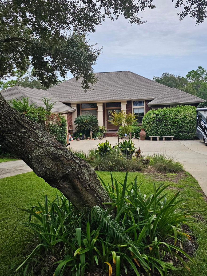 PRICE REDUCED !!!!NEWLY PAINTED interior boasts a warm, neutral color, giving this home a bright, clean and welcoming appearance. Located on nearly one acre in the beautifully established Tom King Estates, this 4BR/3Bath pool home does not disappoint.Nestled amongst matured trees and  landscaping, this home invites you in with its long circular driveway and charming front entrance.The large foyer welcomes you to enter and explore the many beautiful features in this home:Large formal dining room, huge formal living area (fireplace)and a bright family room (fireplace) overlooking the backyard and pool.The spacious kitchen is a chef's dream, featuring a huge center island, tons of cabinetry, upgraded gas stove, granite and additional eating A walk in pantry offers tons of additional space.  The Master suite includes two walk in closets, a spacious master bath and a large sitting area with private entrance from updated screened enclosure. An additional bedroom is located right outside the master bedroom that was used as a private office.
The Interior of this home makes it perfect for entertaining!!!
AND the Exterior will have you wanting your family and guests to enjoy the outside beauty.
Upon entering the back yard oasis, the pool, hot tub, large decks and screened porch will certainly impress.
If that's not enough on this .97 acre lot, there is a large detached building with attached Greenhouse that gives tons of space for all your "extra Things."
This oversized lot measures in at 102' x 433' and abuts to a canal adding to it's enticing character.
With plenty of beauty, wildlife, greenery and water, this gorgeous place, is a must see to fully appreciate.
 
