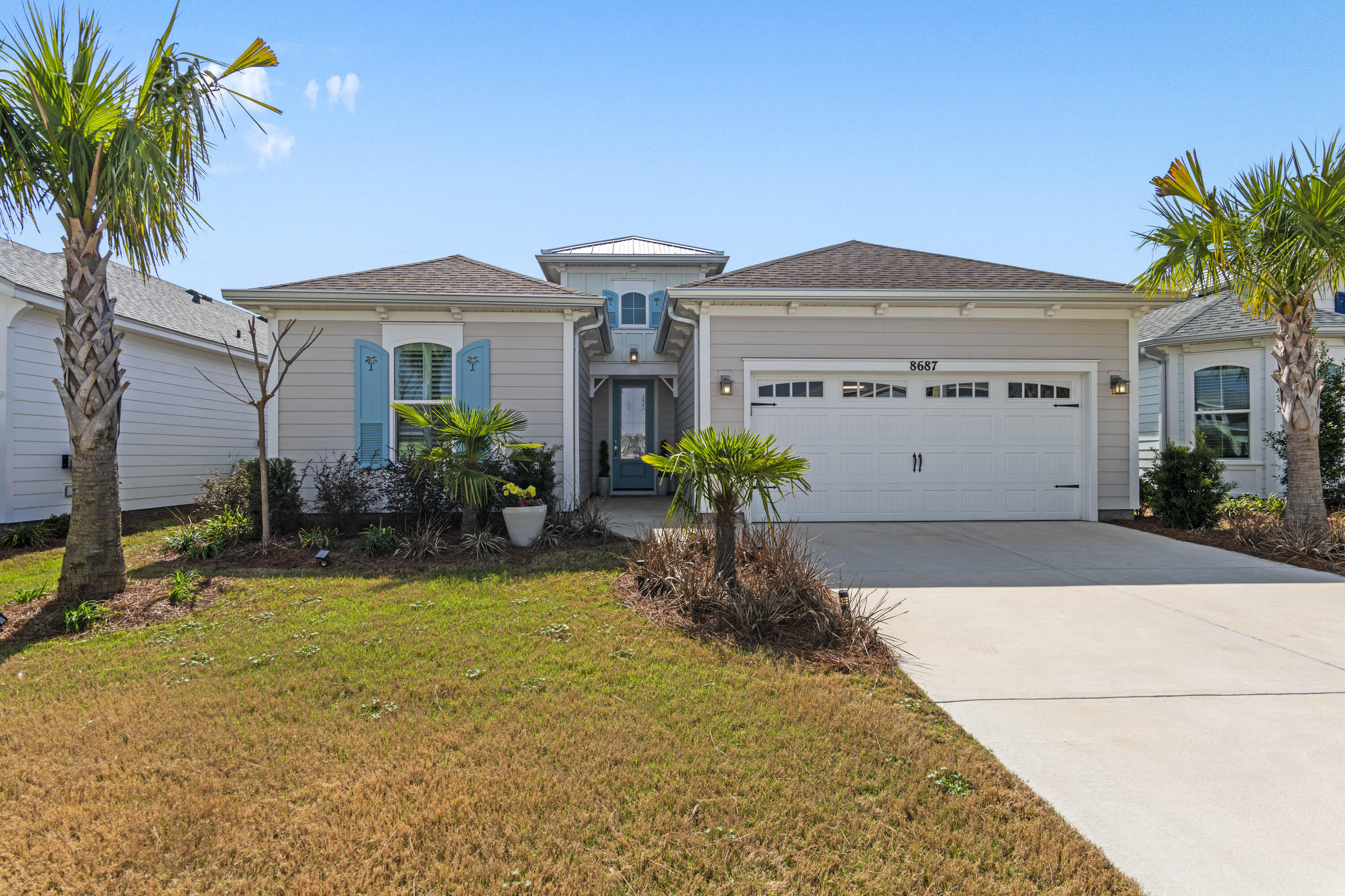 Welcome home to Latitude Margaritaville Watersound - an exclusive 55+ community located in the scenic Florida panhandle, near Panama City Beach and the renowned 30A corridor. This newly constructed Coconut Plan home, meticulously decorated by its homeowner, an accomplished interior designer, offers a premium living experience with sophisticated luxury at every turn.The gourmet kitchen features custom cabinetry with soft-close doors, pull-out pantry shelving, and a convenient dedicated pots and pans drawer. Both the kitchen and bathrooms are outfitted with luxurious quartz countertops, designer faucets, and an elegant tile backsplash. The bathroom cabinetry has been thoughtfully upgraded, with the master bath offering a double bank of drawers for added storage. Throughout the home, premium tile flooring enhances the bathrooms and laundry area, while the master bedroom and closet boast beautiful high level hardwood floors. Crown molding accents every room, adding sophistication and detail. Ceiling fans and custom lighting are installed throughout the home for year-round comfort.
The spacious living room is elevated with decorative beams, creating a welcoming and refined atmosphere. Every room has been thoughtfully designed with an eye for elegance and style, ensuring a seamless blend of comfort and opulence. The screened-in lanai offers an ideal space for outdoor relaxation, and relaxing pond views that are perfect for enjoying the mild Florida climate.
Additional thoughtful features include extra electrical outlets, an attic pull-down for convenient storage access, and a stylish glass front door.
Latitude Margaritaville Watersound offers an unparalleled living experience in a vibrant 55+ community and is the most coveted and sought after community in the United States! With unparalleled amenities such as restaurants, a fitness center with numerous fitness classes offered, bar, resort style heated pool, indoor pool, Pickleball Courts, Basketball Courts, and live music Daily. Friday and Saturday night concerts will keep you entertained throughout the year! Additional amenities includes a full size theatre, Barkaritaville dog spa, woodworking shop, business center and community rooms for clubs, groups, tastings and food demonstrations. The public retail has also begun with the golf cart store in full swing, Capital City Bank is about to open and anticipating the grocery store, restaurants and other boutique shopping soon as well as the Public Marina...all through St Joe!
Don't miss the opportunity to experience this exceptional, designer-inspired home. Contact us today to schedule a private viewing.