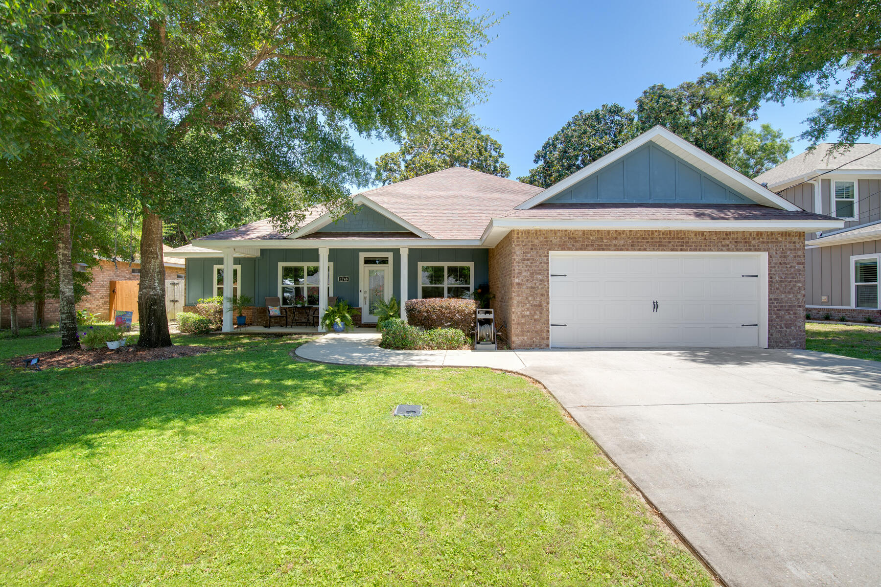 WOWZA! WELCOME HOME TO A BEAUTIFUL WELL KEPT 2017 BRICK HOME. CONVENIENTLY LOCATED NEAR PUBLIC SOUND ACCESS & A HOA DEEDED WATERFRONT AREA W/DOCK. A LG 28' COVERED FRONT PORCH GREETS YOU & upon entry the long foyer guides you into an open LIVING ROOM w/recessed box ceiling, crown molding & fan that nicely accentuates the room. French doors open to a Lg cozy back patio. Gorgeous KITCHEN is open to living room for the perfect gathering space. Tall cabinets, soft close drawers & doors, granite counters, built in island w/wine cooler, eat up bar w/room for 4-6 barstools, pendant lighting, SS appliances & back splash completes the area. BREAKFAST NOOK is nestled w/ample room for Lg table. MASTER BR has recessed box ceiling w/fan, crown & glass door to back patio. MASTER BATH is spacious... with a long, roomy double vanity, tile surround soaking tub, fully custom tiled separate shower w/seamless glass, pebble tile floor & a modern flat shower head panel system. BATH 2 is roomy & perfectly designed for sharing for the kids. Two granite vanities are separated by the entry door with a separate lockout area for the shower/tub combo/toilet area. A convenient HALF BATH is located off the kitchen/living area for guests.
BEDROOMS 2, 3, & 4 are roomy & split from Master BR. All have ceiling fans, Panel door swinging doors & carpet.
ADDITIONAL NOTABLE HOME FEATURES:
Beautiful & Durable Wood Plank Tile. Finely Appointed Base & Door Molding Throughout. Attractive 5 Panel Doors. Separate Dining Room/Office Space. Roomy Breakfast Table Nook. Granite Counters. 2" Blinds. Large Master Walk-in Closet w/Multi Shelving. Energy Efficient Earth Cents home w/quality Low E Vinyl Windows. 14 SEER Heat Pump/HVAC. Irrigation System w/Well. Privacy Fenced.
29 x 9 Covered Lanai. 28 x 7 Covered Front Porch. Digital Thermostat. Deep Garage. Hurricane Fabric Shield Panels.
This Home Is Located a Mere 750 Feet From The "Joybrook Access" Public Sound Access & Also Just Around the Corner (850 feet) from the Private Magnolia Harbor Deeded Water Access Dock w/Benches and a Walk Down Launch Platform For Easy Kayak Launching.
Gorgeous Views & Sunsets Await!
Joybrook Road is Conveniently Located Right Across HWY 98 To the Neighborhood Walmart Store. Also Near Beaches, Bases, Schools & Shopping.
*This Property has an Assumable VA Loan at a 2.25% rate for Qualified Buyers.
THIS IS A GREAT HOME AND A MUST SEE!!