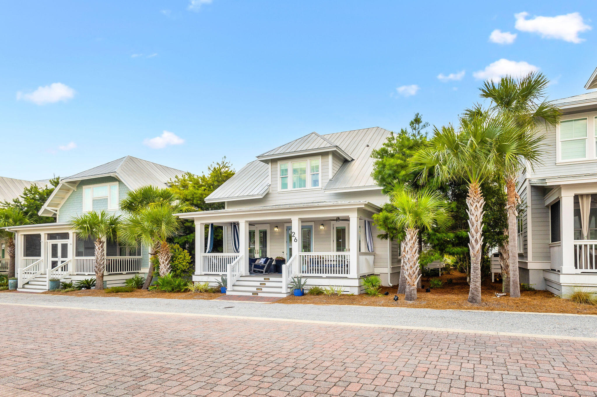 Waltz back in time to experience carefree days and front porch hellos. Welcome to 26 Federal Street, where Classic Americana meets Modern Luxury. This quintessential beach cottage on the most peaceful street in the neighborhood is perfect for a primary or secondary residence, and an incredible investment opportunity with yearly rental projections of up to $140,000. Elegantly decorated, this home comes FULLY FURNISHED. Enjoy beautiful hardwood floors, stone countertops, 10-12 foot ceilings, 8-foot doors, and unique design details at every turn. With 3 bedrooms and a bonus bunk room, this gem comfortably sleeps 10+ guests. It boasts a dreamy front porch, a detached TRUE 2-car garage, an outdoor shower, and beautiful landscaping. This dream home is turn key ready and truly has it all.