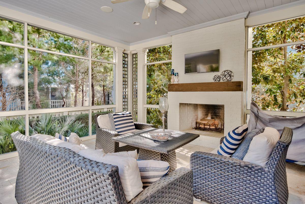 Located in prestigious WaterSound, this high-end home exemplifies coastal living at its finest. TS Adams Architecture collaborated with Gulfview Construction to create a bespoke home that boasts an extraordinary finish throughout with exceptional attention to detail. Check out the Venetian plaster walls and ceilings accentuated by reclaimed wood beams and appreciate the use of natural daylight through transom window above the doors. Custom stone flooring in the main living areas gives way to reclaimed light oak hardwood in the bedrooms. The generous sitting area room is accentuated by a custom fireplace which adds a focal point to this welcoming space. Peek over the half-height wall that separates the kitchen from the formal dining and living area and see what's cooking.