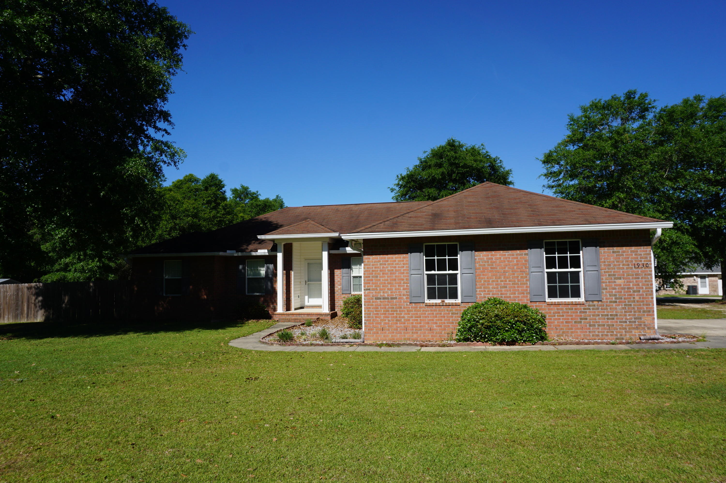 1 ACRE! Country home with fabulous privacy. This home sits on the corner of a 1 acre lot and has so much to offer. 4/2 Floor plan with office space features many upgrades. Enter into a foyer and open concept living room. Eat in kitchen area with breakfast bar. Kitchen features deep drawers and newer appliances. Fantastic laundry room with high end washer and dryer included. Large bedrooms and neutral paint throughout. Spacious master bedroom and bathroom. 2 car garage with additional parking. This home has a double gate for the back yard for recreational vehicle parking. Yard buildings and so much more. Country at its best.
