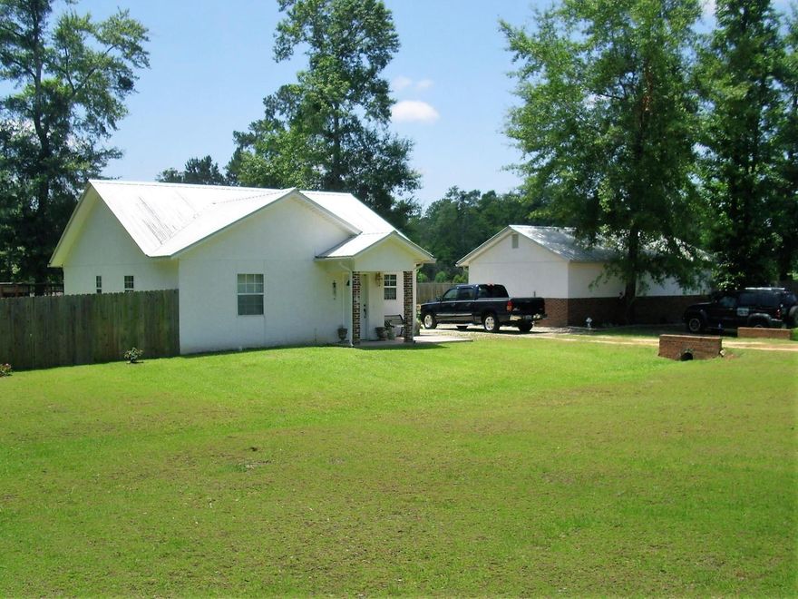 A very well built quality home in Ponce de Leon, FL. It is a 2 bedroom, with 1 1 /2 baths, with a large 2 car garage/workshop. Seller has architectural plans that can be included in the sale if you would like to join the large garage to the home for more living area and bedrooms. Recent survey is attached. There is an I-10 on ramp within 1 mile. This home is eligible for 100% financing with VA or USDA, so give us a call.