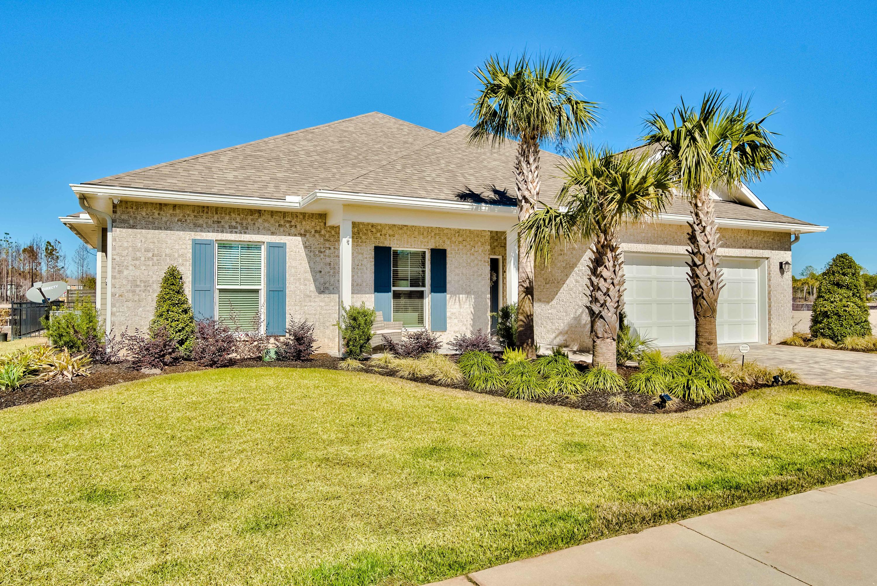 Experience what designer quality, single-story living is all about in the up-and-coming, gated community of Lakeview on the west side of Scenic 30A. Pristine in detail, this coastal retreat offers unrivaled in-home amenities including 2 gas fireplaces, one inside the open living room, looking out to a picture-perfect backyard setting with privacy fence; the other hearth is surrounded in brick on a luxuriously tiled screened-patio. A chef's kitchen flows to the spacious dining room. A built-in office tucks away off the living room. The master suite, crowned with a tray ceiling, provides access to the screened-porch and offers a true luxury masterpiece bathroom with a one-of-a-kind tub and walk-through shower room combination.