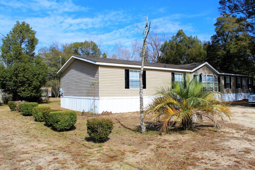 *SELLER FINANCING AVAILABLE TO MOST BUYERS* Updated, new carpet, fresh paint..this home is like new! The large kitchen overlooks 2 living spaces, one of which has a wood burning fireplace and sliding glass doors to the deck. The master bedroom is more like a master suite with a bonus sitting room, walk-in closet, and large master bath.