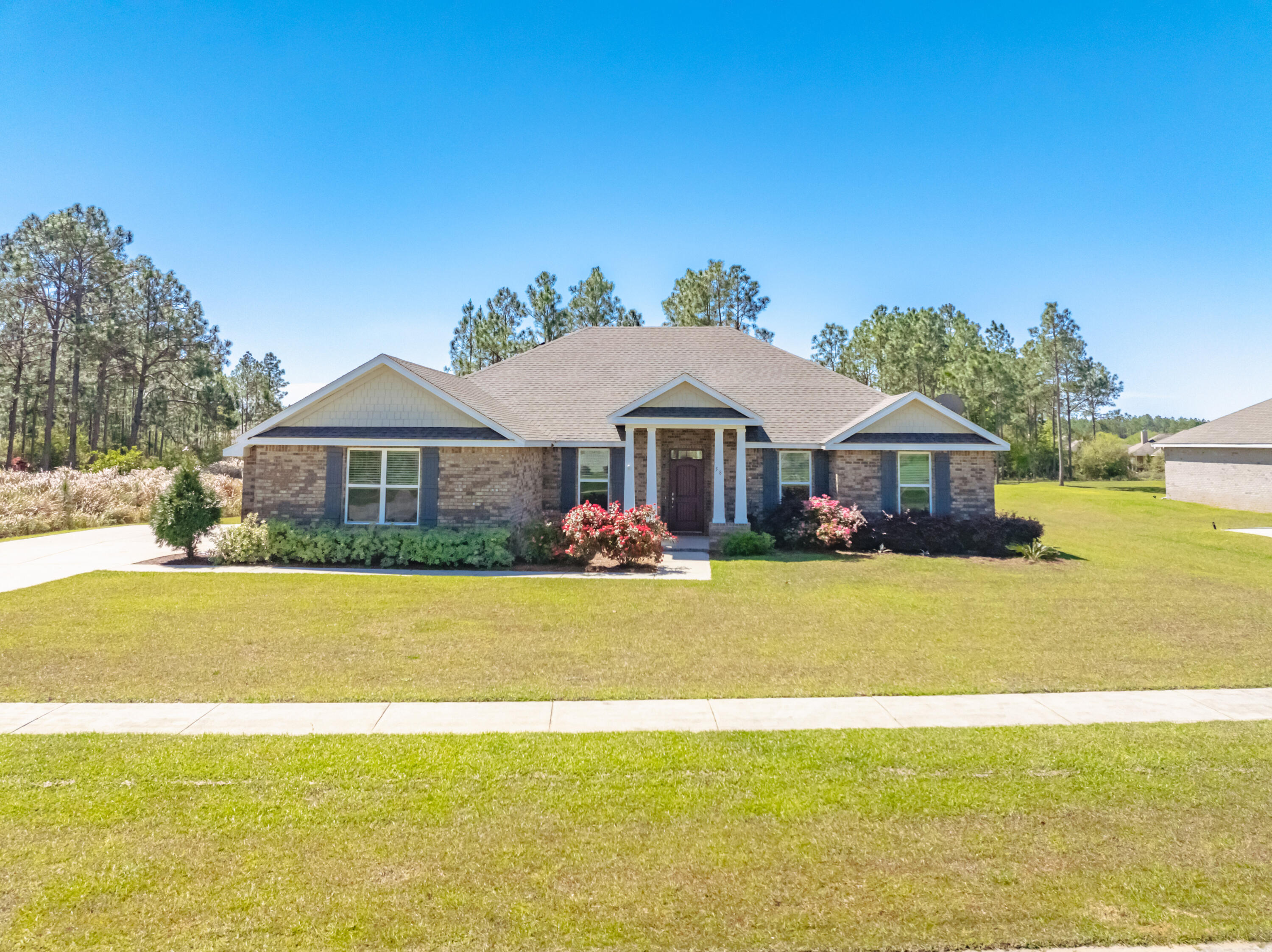 2.875% FHA ASSUMABLE LOAN ($288k payoff) Experience luxury living in a gated, golf course community, low HOA in this gorgeous Holiday Home build! It offers a spacious 4 bedroom 3 bath home w/ separate dining and office at Hole #13 of Windswept Dunes! This home offers a gourmet kitchen with upgraded appliances and ample storage. The open floor plan is bathed in natural light, showcasing 10 foot ceilings in the great room, granite countertops, upgraded fixtures, new epoxy garage floor, LVP and all NEW carpet in bedrooms. Spacious living areas and a primary retreat w/ sunroom on a generous .49 acre, this home is sure to please everyone. Community amenities include large swimming pool, pickle ball, basketball, tennis & playground. Located 25 mins to Beach! Great Rental 6mo min $3500/mo approx