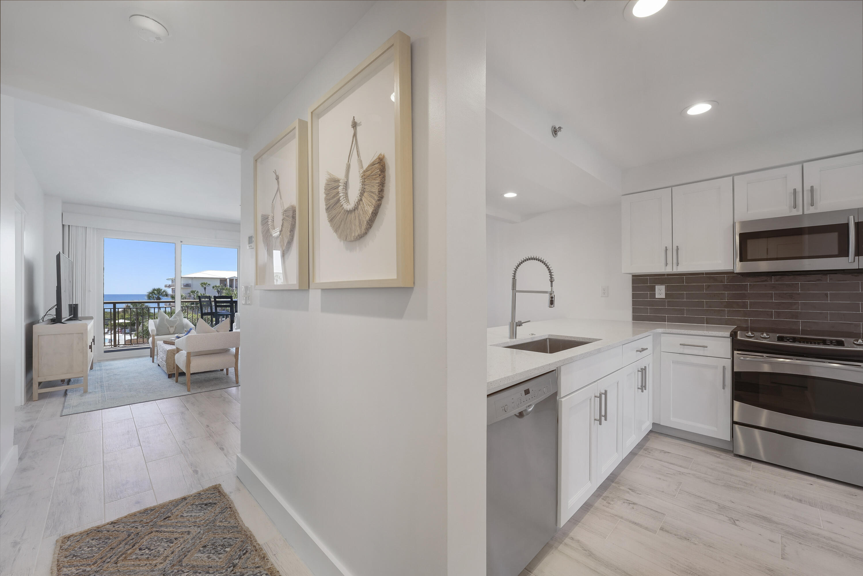 Remodeled and renovated in 2022, this classy 2-bedroom beach condo delivers spectacular unobstructed direct views of the Gulf of Mexico from the master bedroom, living room, dining room, and kitchen. Plus, you get to enjoy your own private beach in a premier location conveniently tucked between Alys Beach and Rosemary Beach. The owners have carefully crafted this remodel with the astute 30A buyer in mind, with updates that include wood-look tile floors, new sliding glass storm doors, new vanities and light fixtures, recessed lighting, quartz countertops, and new coastal decor and furniture designed by Marisol Guillo.