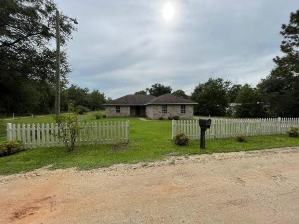 Well-kept 3/2 brick with 1408 sqft on a 1-acre lot outside of Holt, FL.Move-in condition inside and we've allowed budget for a new roof (not leaking) and some landscaping in our price.