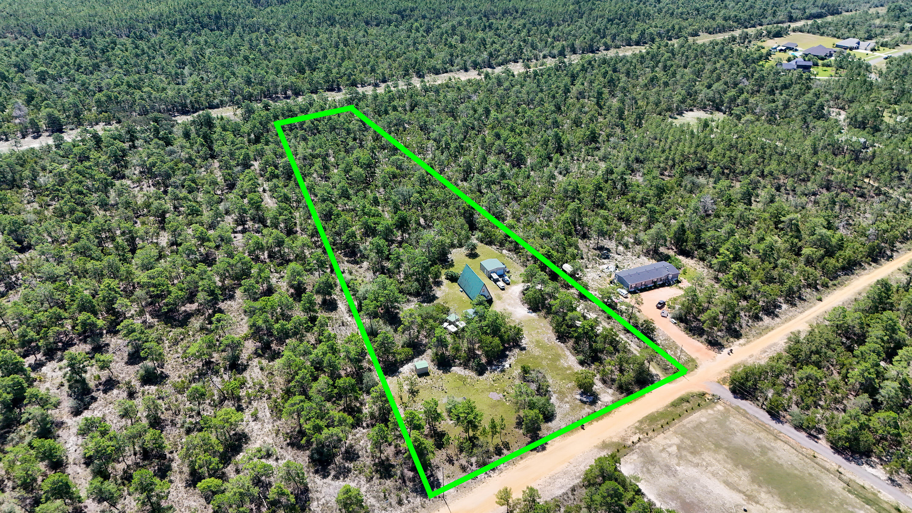 Tucked away on 4.66 acres in the rapid growing Freeport area, this unique A-frame home offers space, privacy, and potential. The home features a distinctive design and a large detached garage/workshop, great for storage, hobbies, or future projects. With room to spread out and make it your own, this property is ideal for those looking for land and opportunity in a great location with No HOA. Buyer to verify all information deemed important.